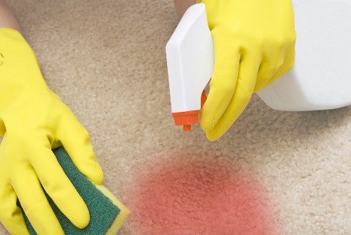 Professional carpet cleaner in Roehampton cleaning a living room carpet
