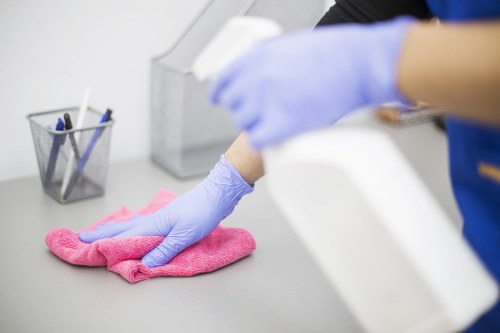 Professional oven cleaner in Roehampton deep cleaning a kitchen oven