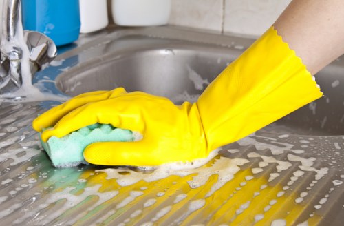 Roehampton office cleaners sanitising high-touch surfaces in a workplace